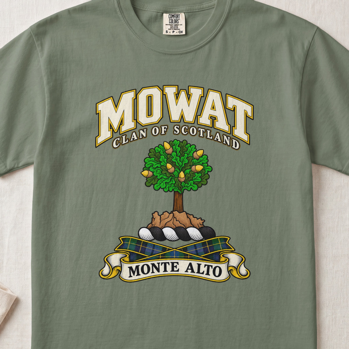 Mowat Scottish clan T-shirt in Moss, front view with a green tree on a rocky mound and motto design.