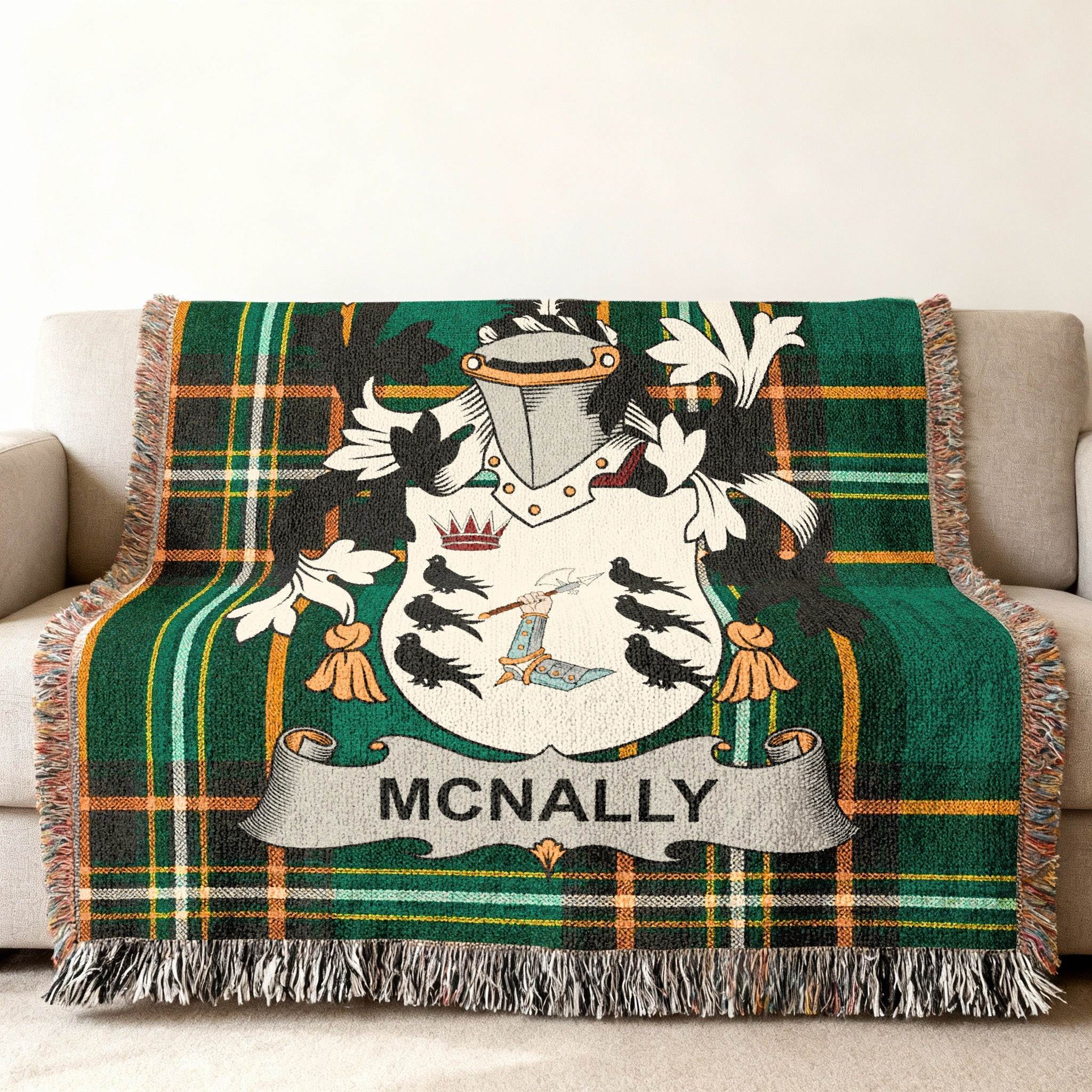 McNally tartan blanket with family crest draped on a sofa.