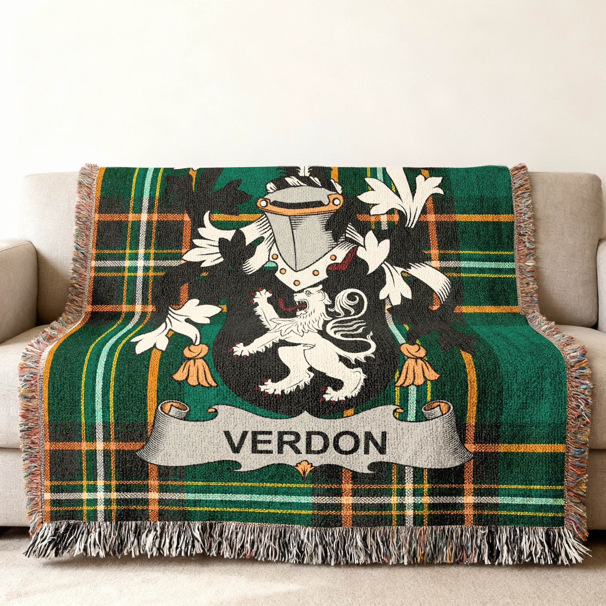 Woven blanket featuring a green plaid design and the Verdron coat of arms.