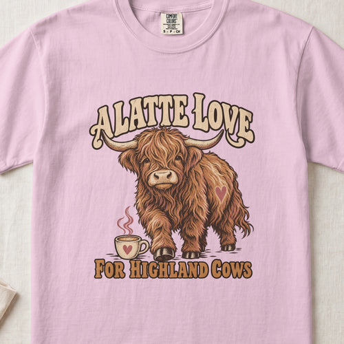 A Latte Love for Highland Cows Highland cow design on a Blossom Comfort Colors 1717 T-shirt, flat lay