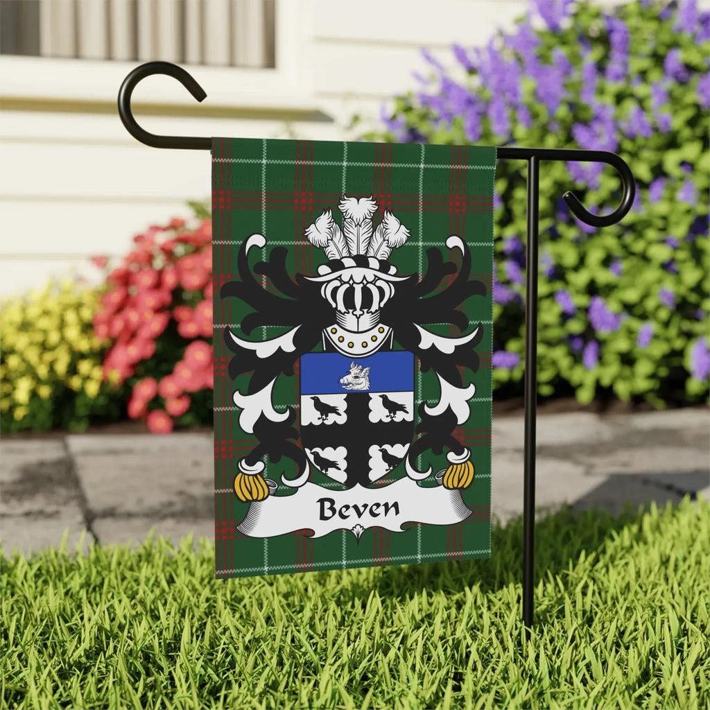 Beven family crest on a green plaid garden flag.