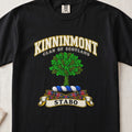 Kinninmont Scottish clan T-shirt in Black, front view with a green tree and motto banner.