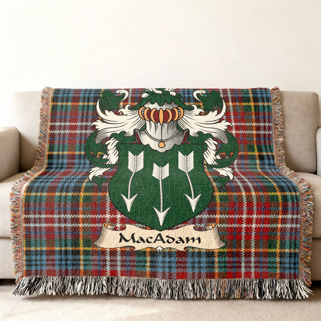 MacAdam family crest emblem on a Caledonia tartan woven blanket