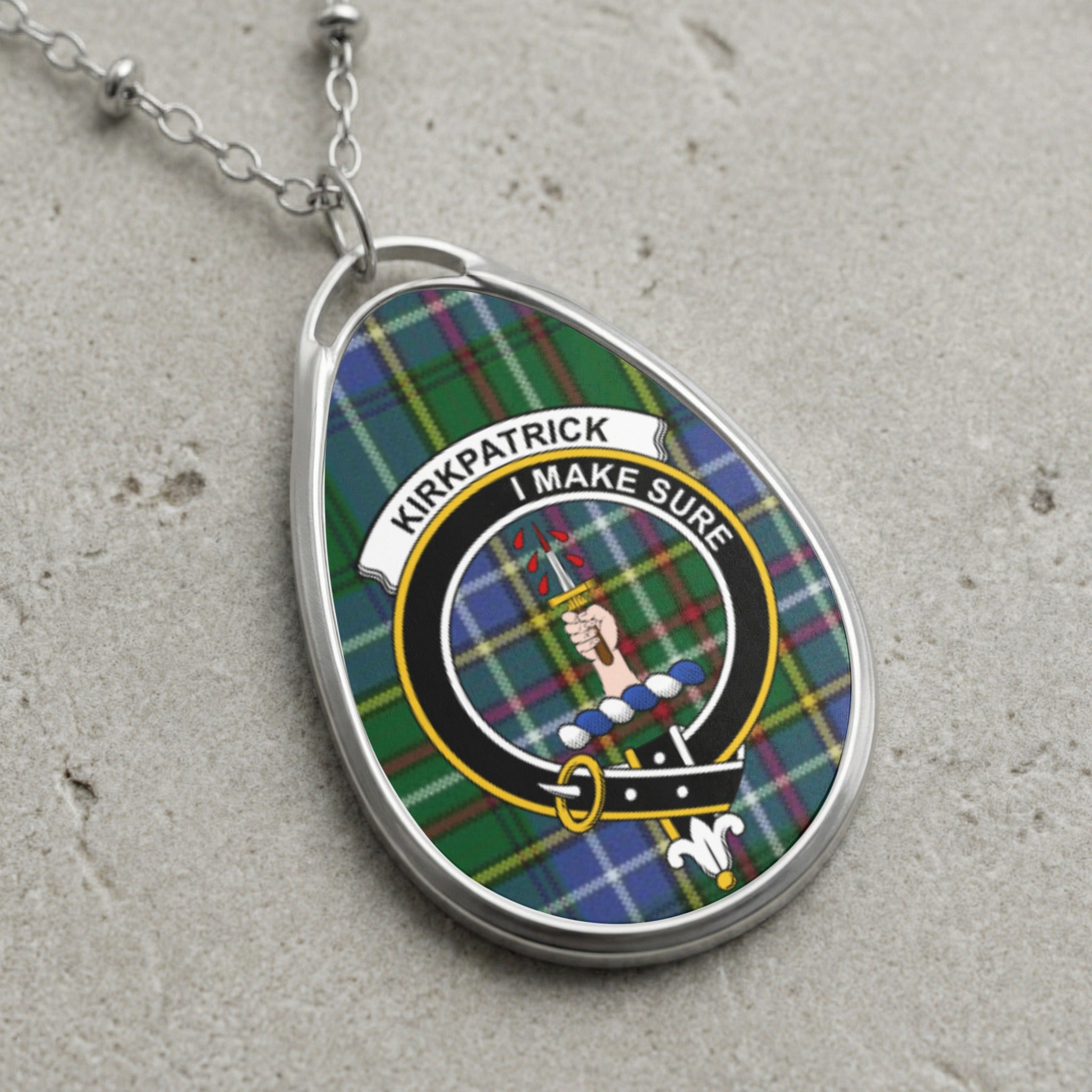 Kirkpatrick clan Scottish tartan necklace with clan crest and I Make Sure motto on tartan background
