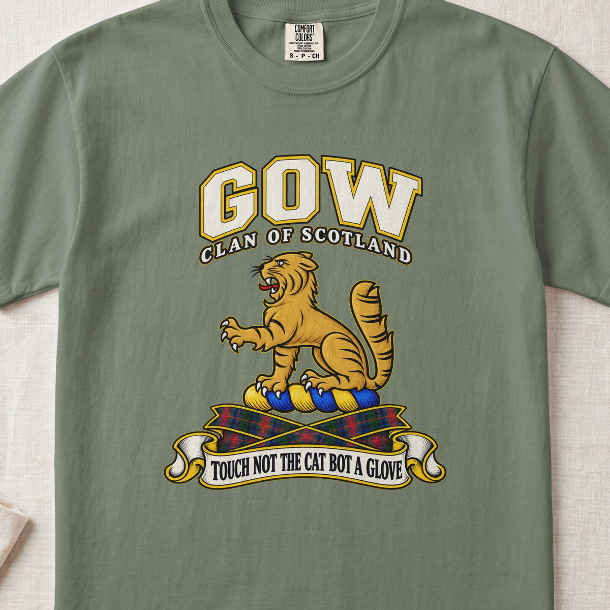 Gow Scottish clan T-shirt in Moss, front view with a golden wildcat and motto design.