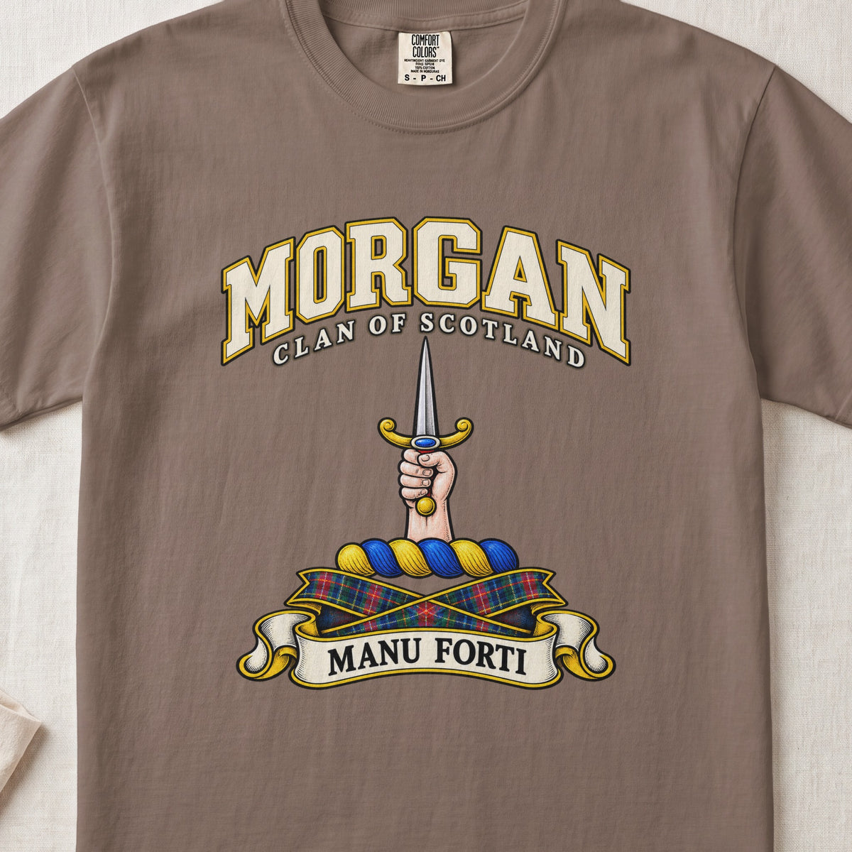 Morgan Scottish clan T-shirt in Espresso, front view with a hand holding an upright dagger and motto banner.
