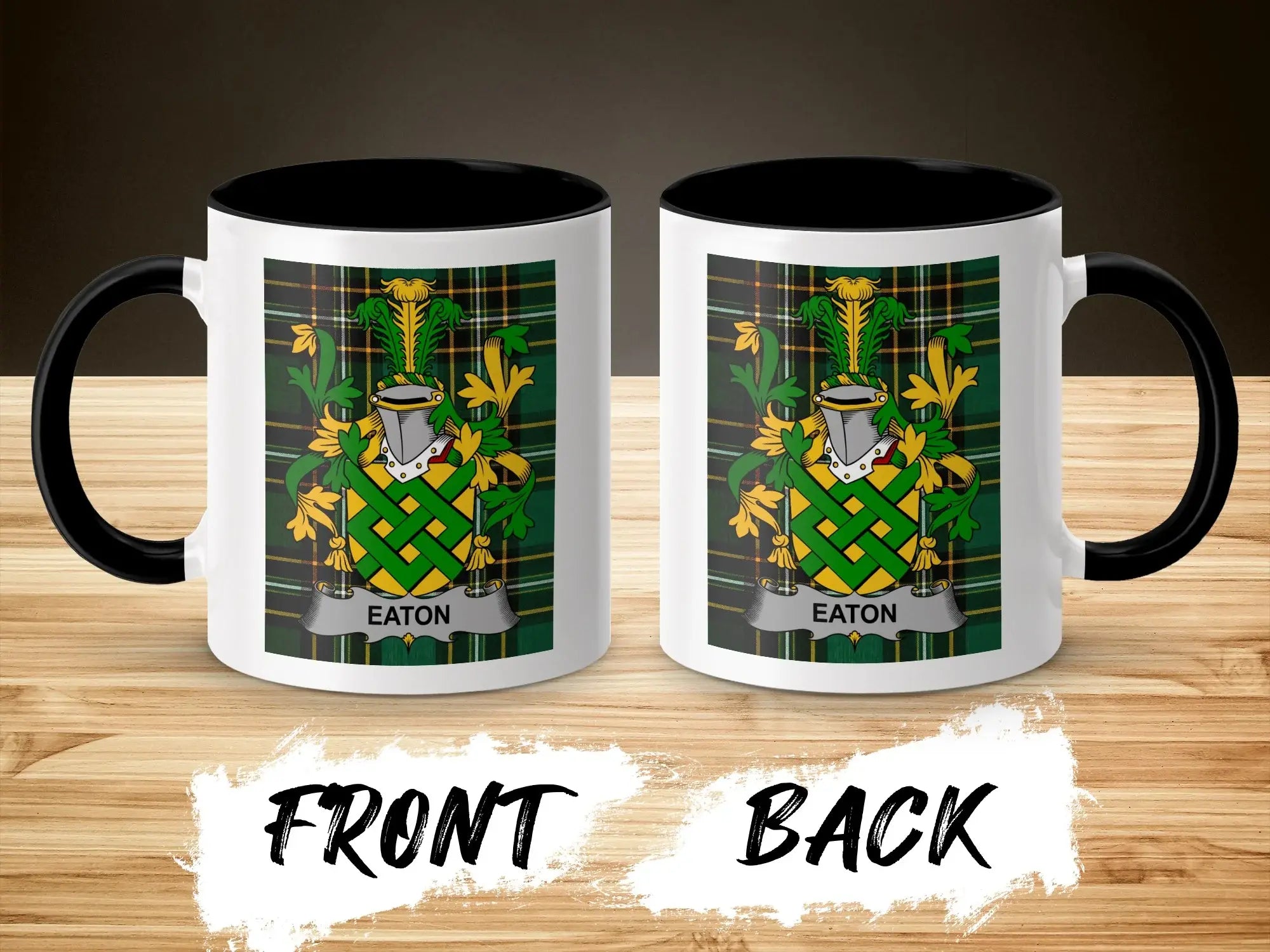 White mug with black handle and "Eaton" family crest on plaid background.