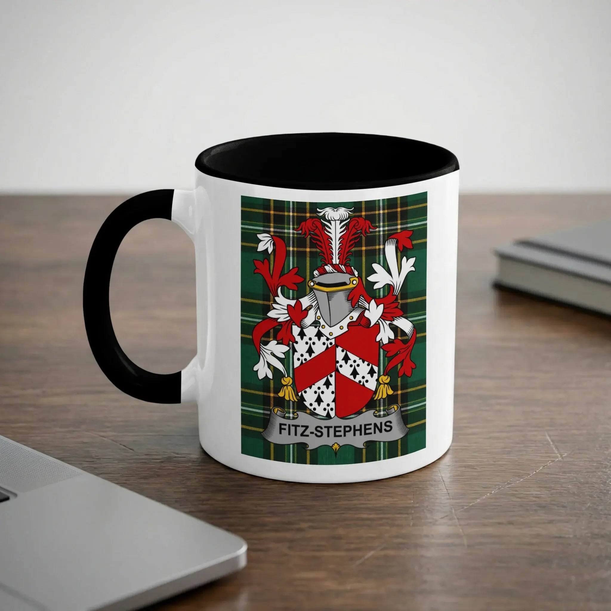 Mug with Fitz-Stephens family crest on a wooden desk.