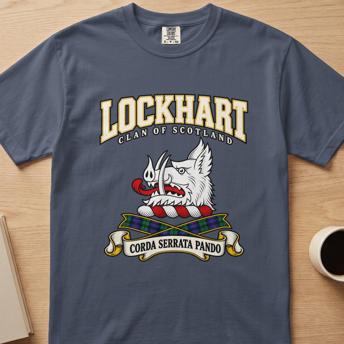 Lockhart white boar’s head and tartan ribbons graphic on a slate blue Comfort Colors T-shirt, front view
