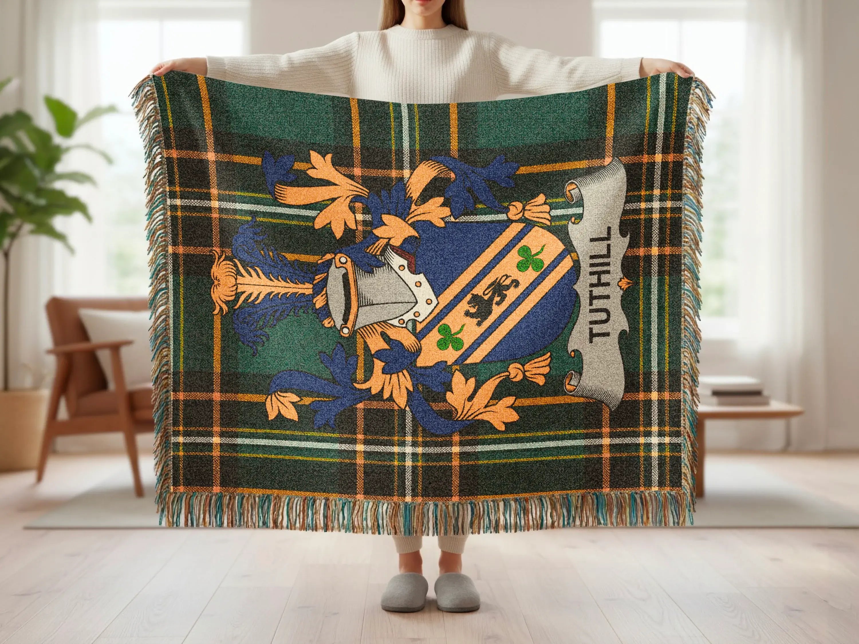 Tartan blanket with Tuthill family crest in blue, green, and orange.