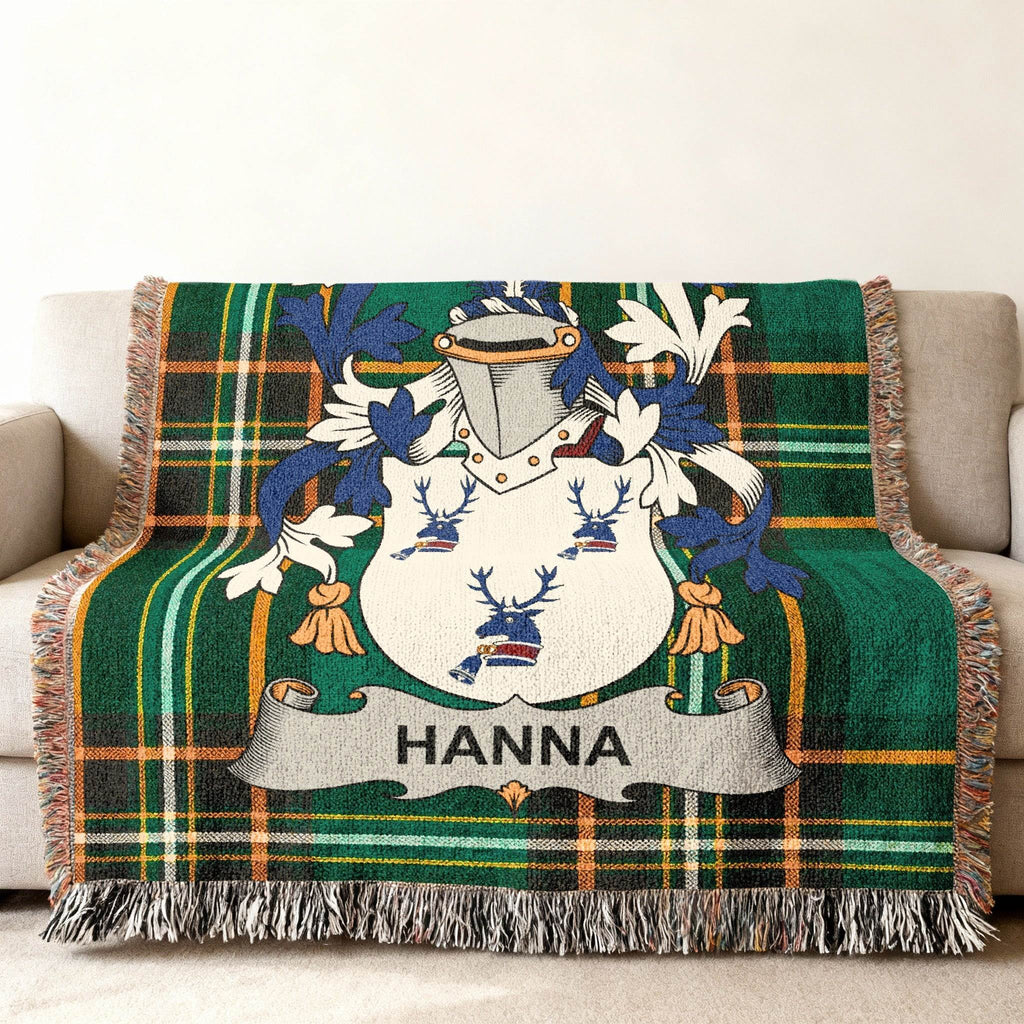 Green plaid throw blanket featuring a coat of arms with the name HANNA.