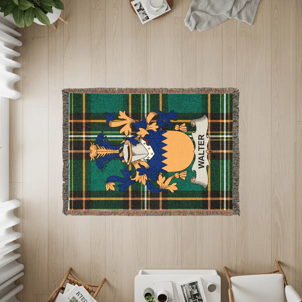 WALTER tartan throw blanket with family crest on light wood floor.