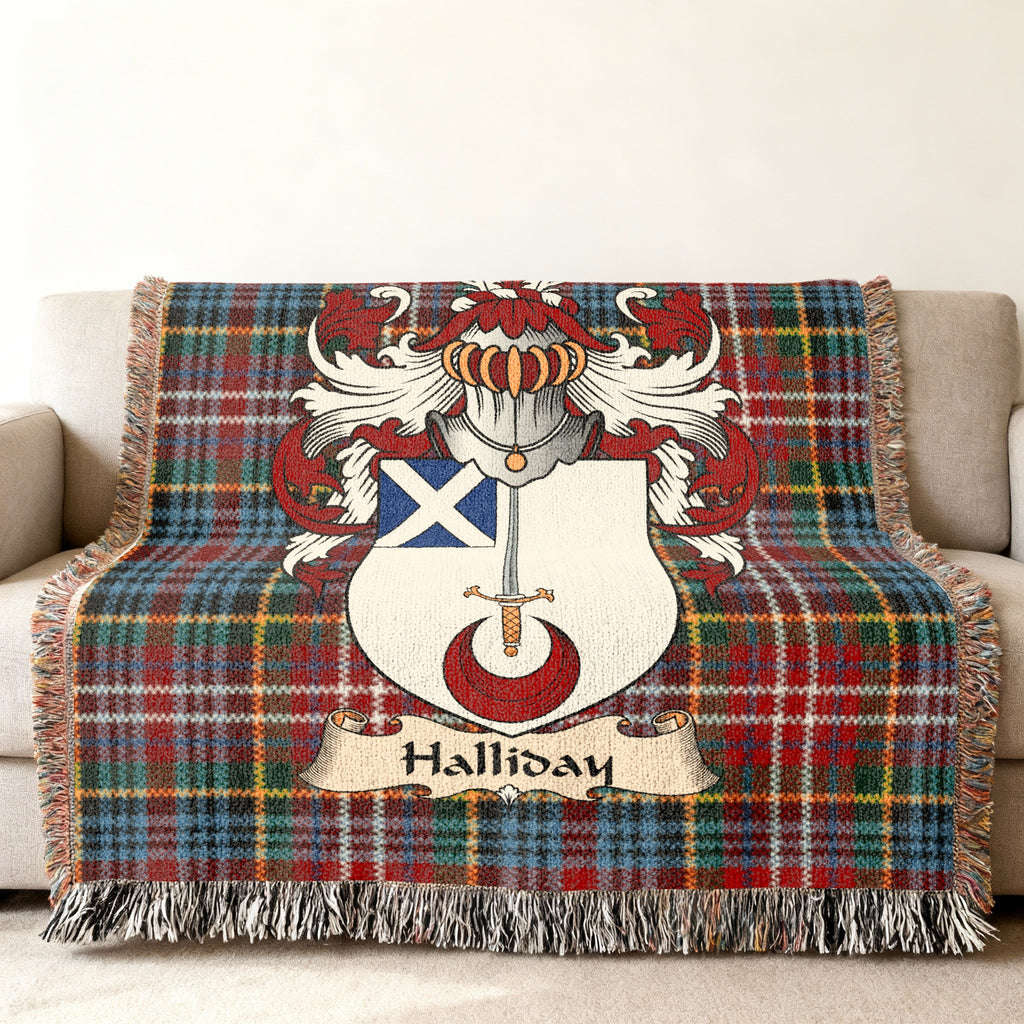 Halliday family crest emblem on a Caledonia tartan woven blanket