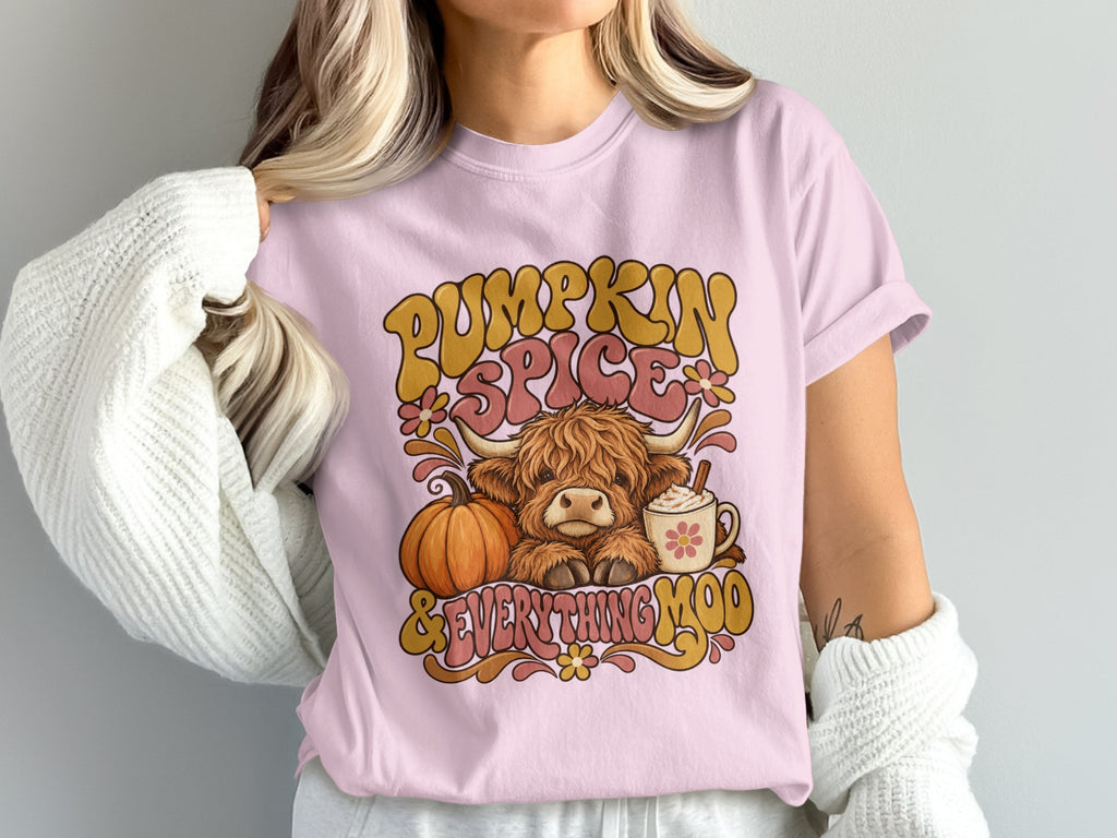 Model wearing the Pumpkin Spice & Everything Moo Highland cow Comfort Colors T-shirt in Blossom