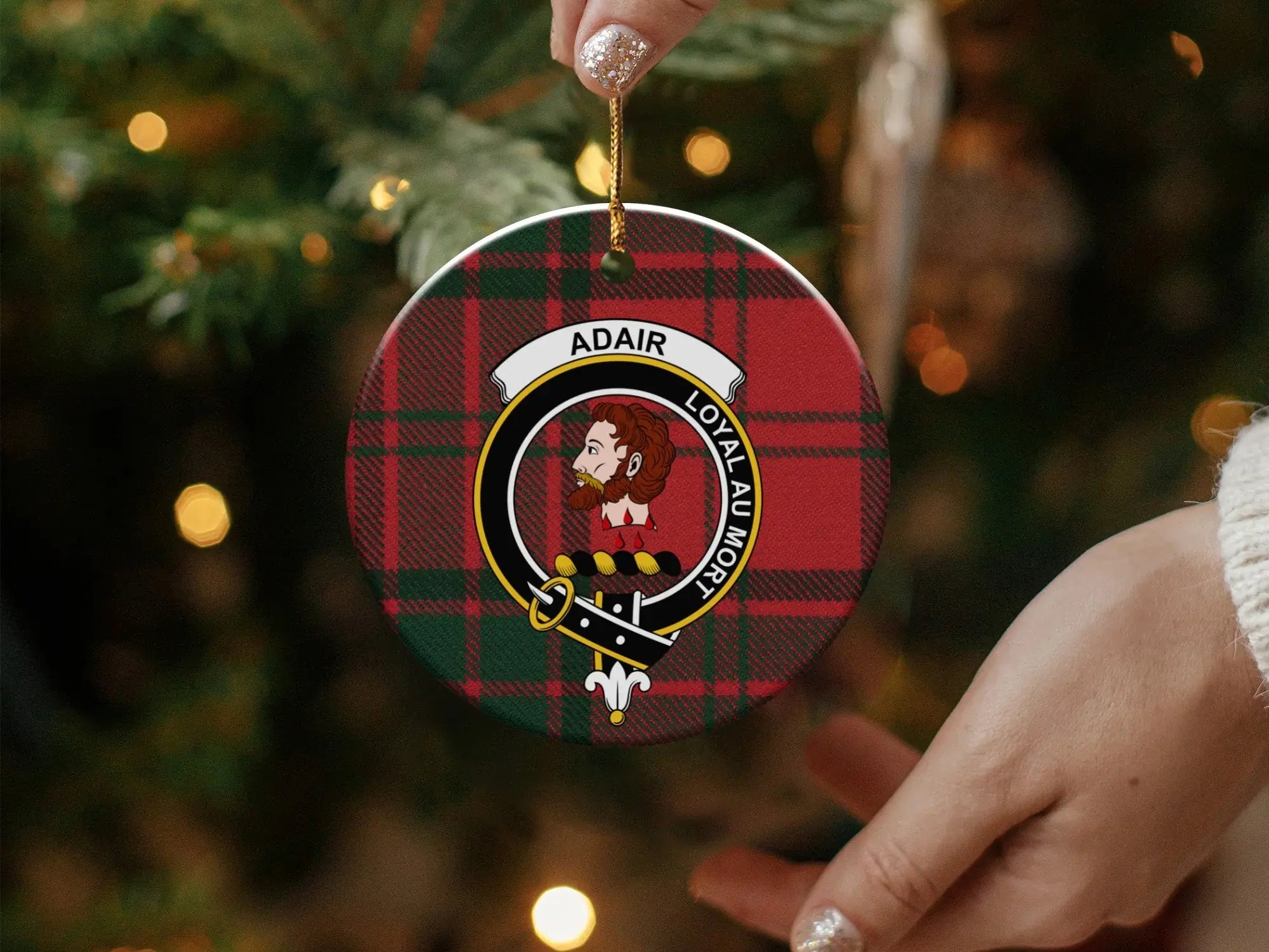 Round Adair ceramic ornament with gold hanging string