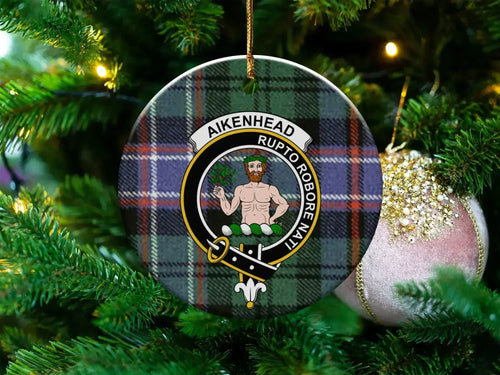 Round Aikenhead ceramic ornament with crest on tartan-pattern background