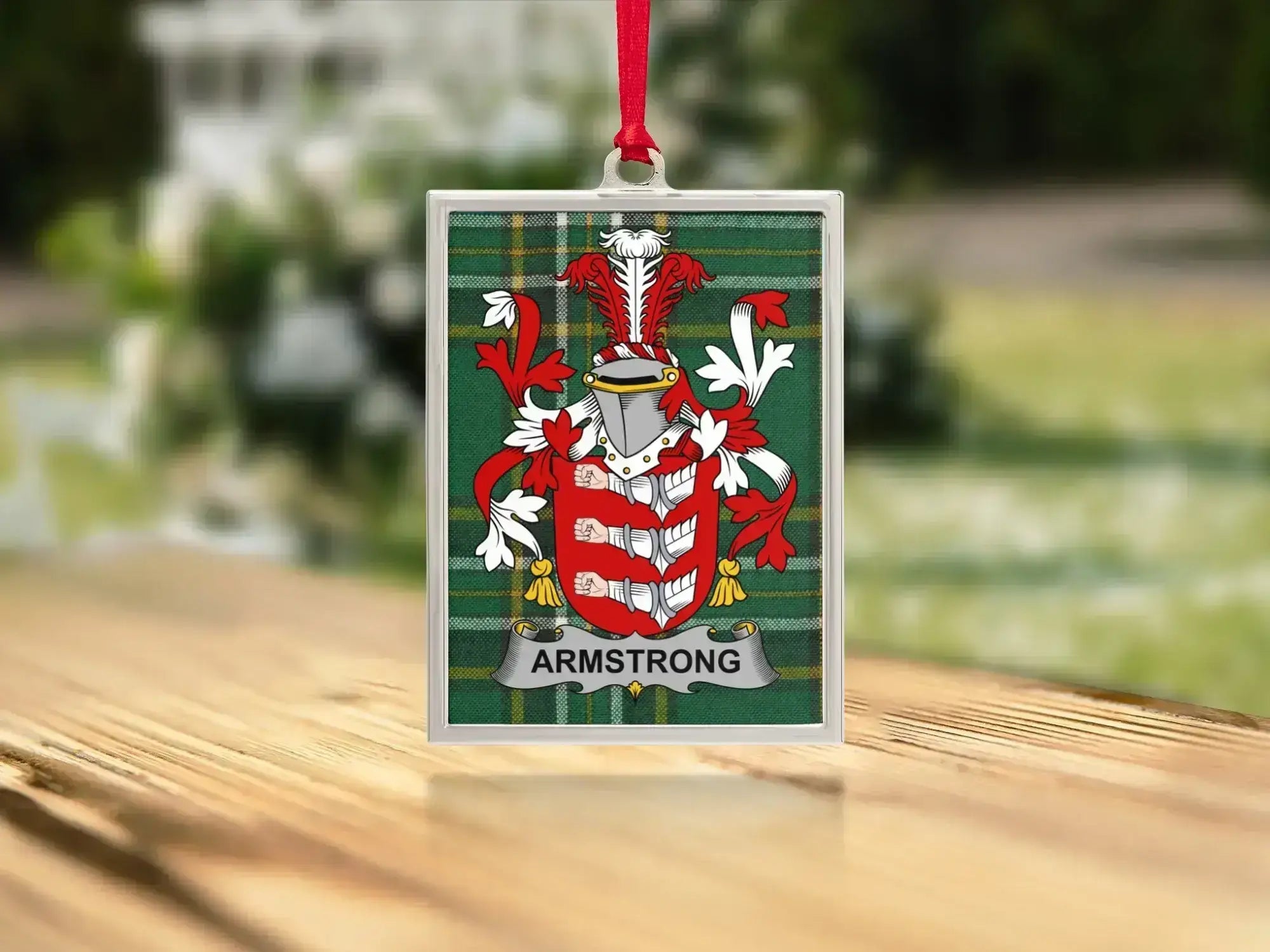 Armstrong coat of arms Irish tartan ornament on tree — polished metal frame, satin ribbon hanger