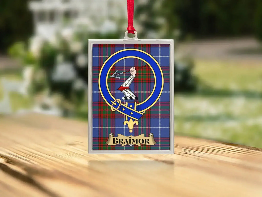 Close-up of the Braimor family crest on a polished silver-frame metal ornament