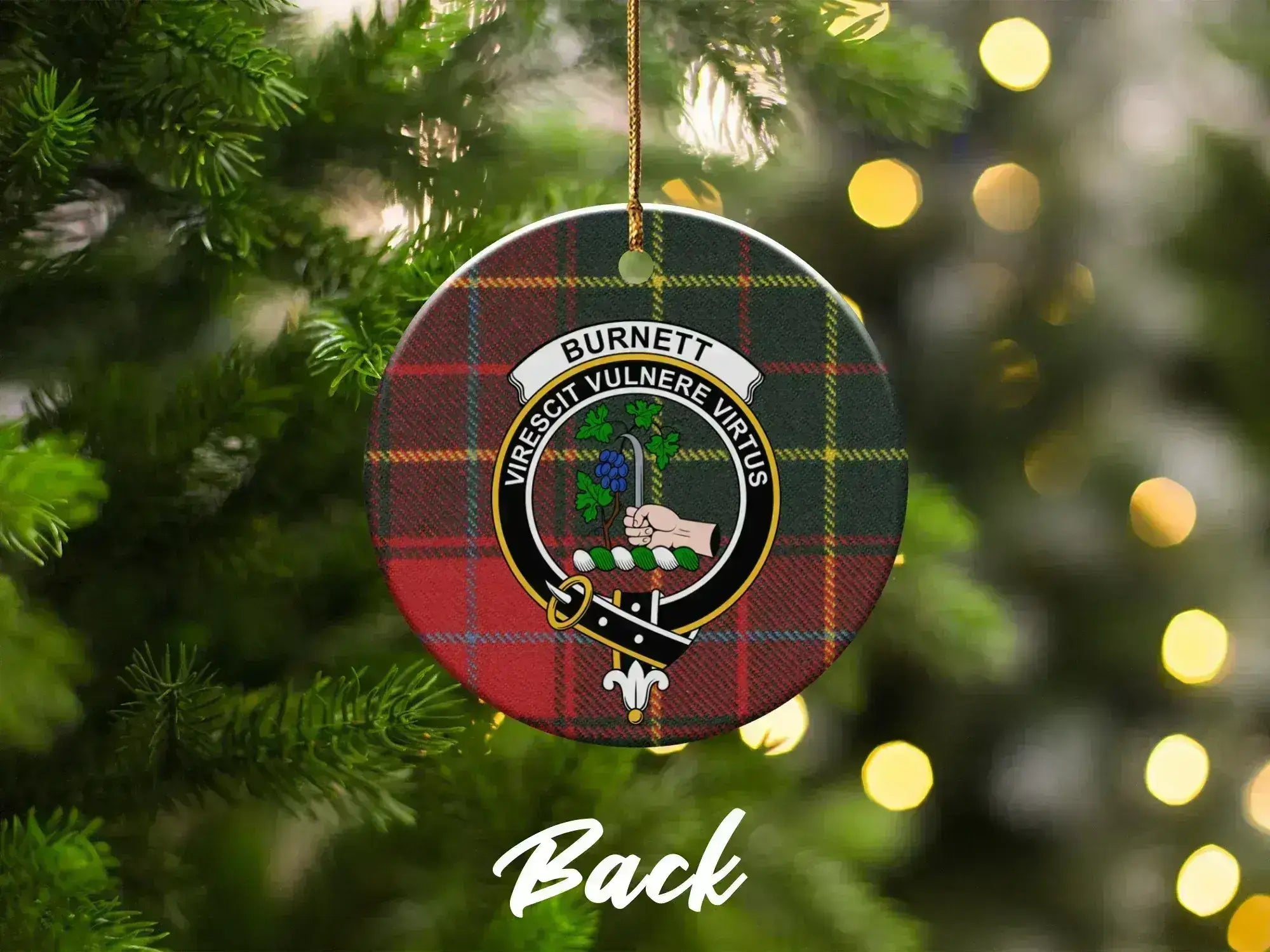 Clan Burnett ceramic Christmas ornament hanging on tree — crest and tartan, double-sided