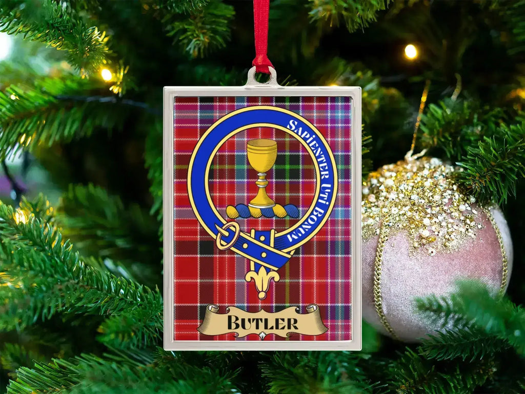 Butler clan crest Christmas ornament in a silver frame on a tartan background