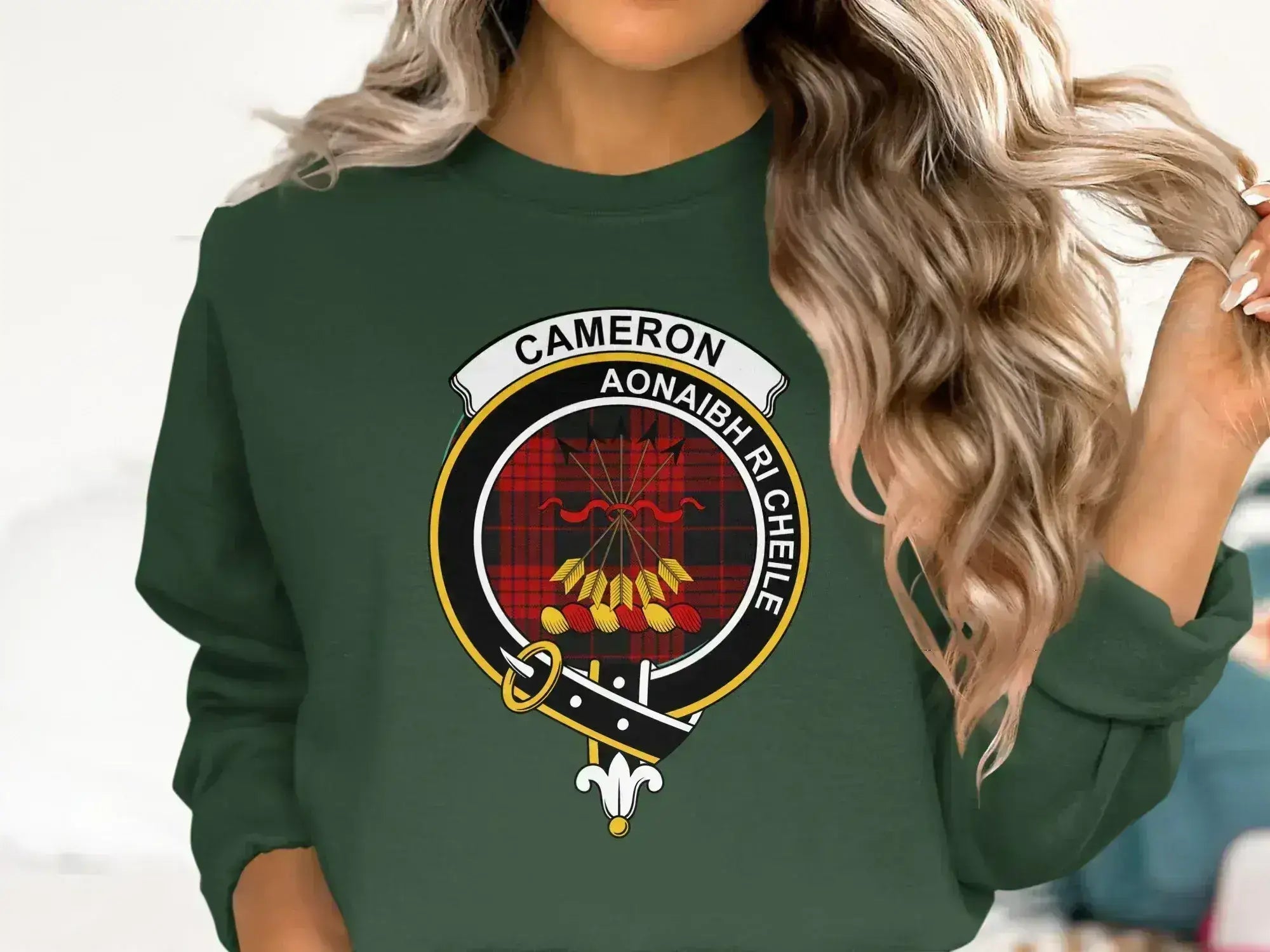 Cameron clan crest sweatshirt in forest green — fleece with red tartan heraldic design