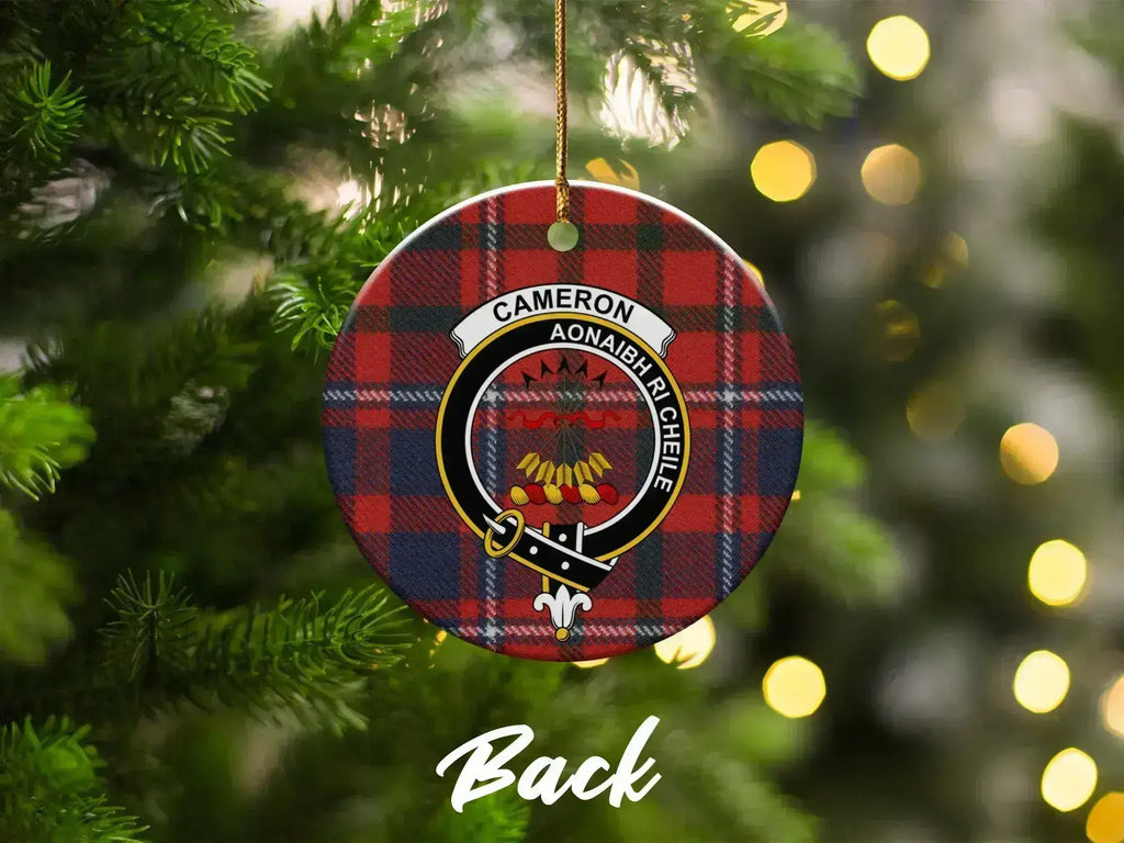 Cameron tartan ornament on Christmas tree — red heraldic crest with Unite motto visible