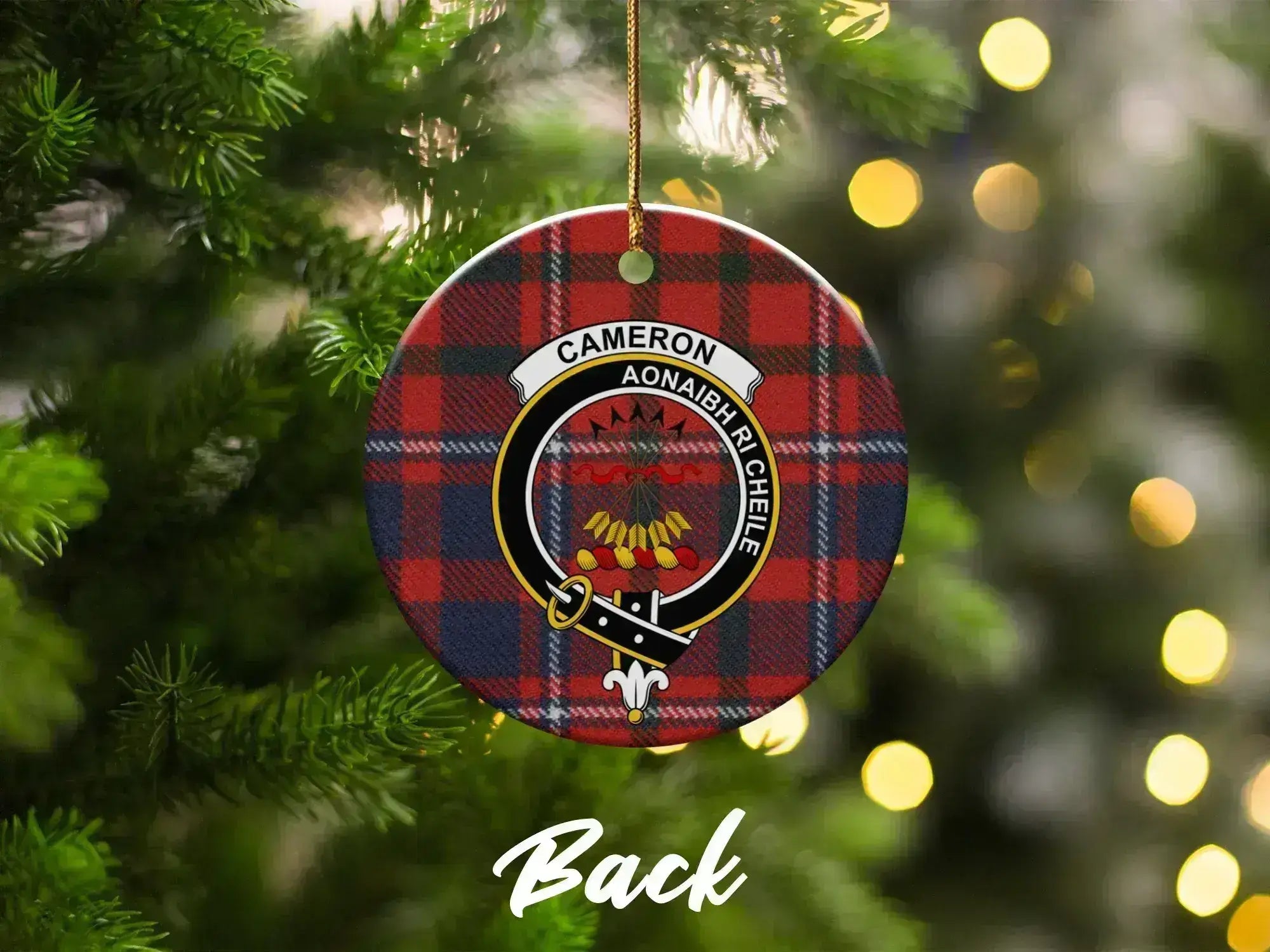 Cameron tartan ornament on Christmas tree — red heraldic crest with Unite motto visible