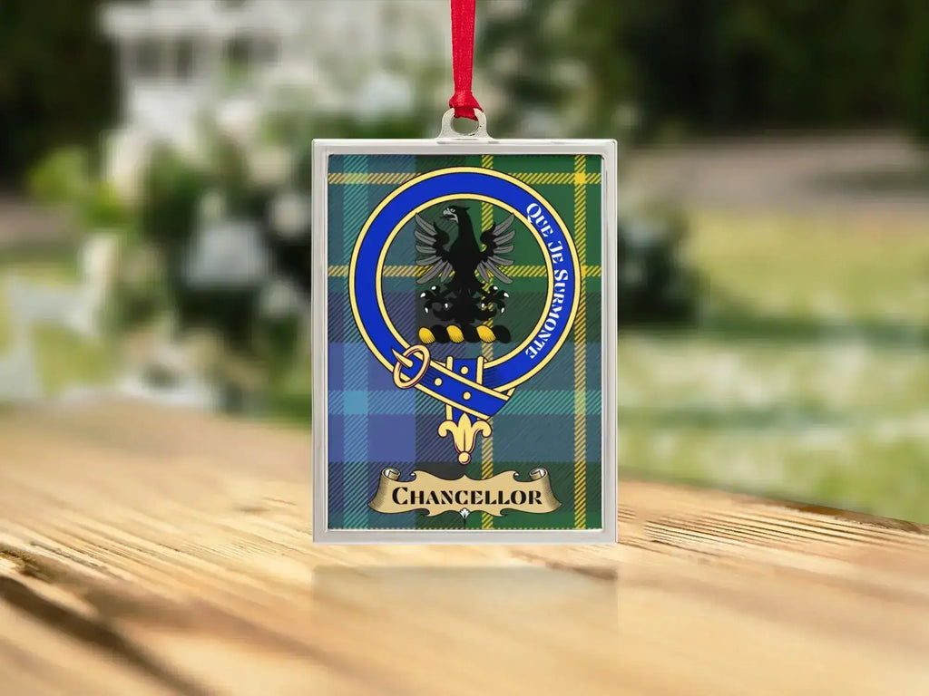 Close-up of the Chancellor family crest on a polished silver-frame metal ornament