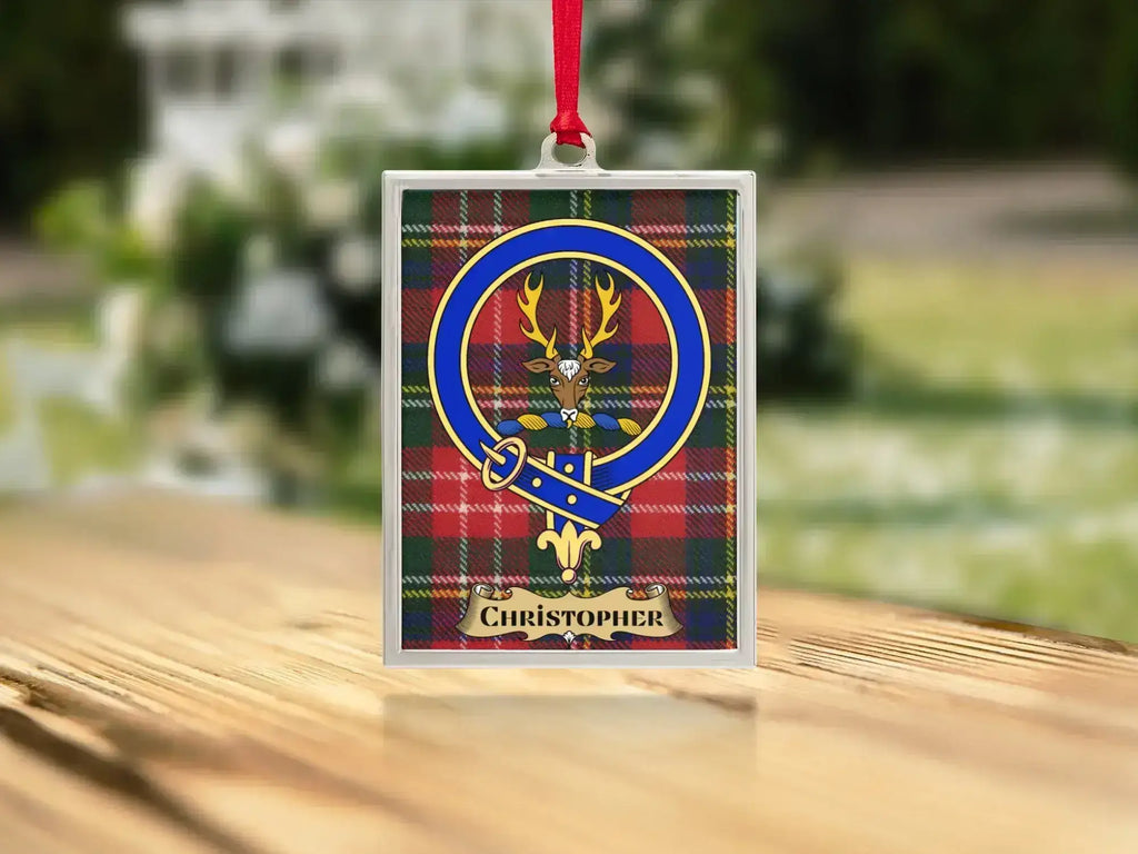 Close-up of the Christopher family crest on a polished silver-frame metal ornament