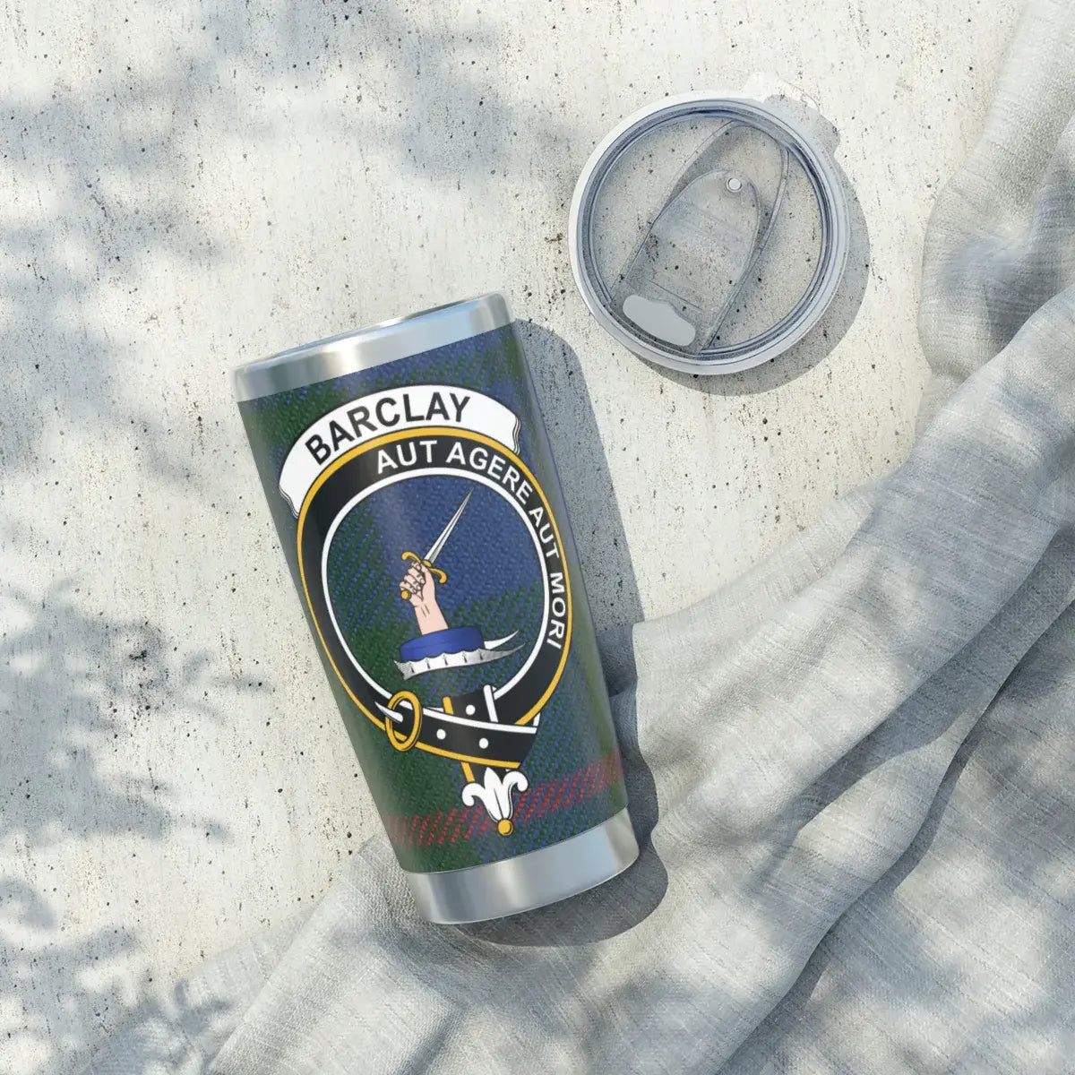 Barclay Aut Agere Aut Mori tumbler lifestyle shot — clan crest and tartan on 20oz silver stainless cup