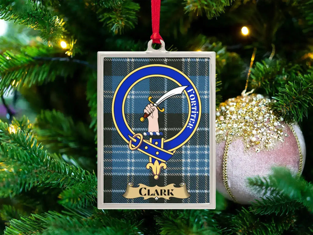 Clark clan crest Christmas ornament in a silver frame on a tartan background