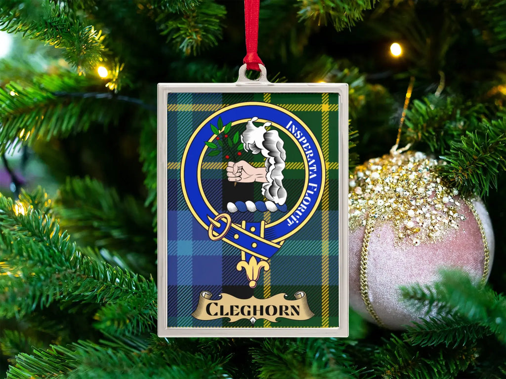 Cleghorn clan crest Christmas ornament in a silver frame on a tartan background