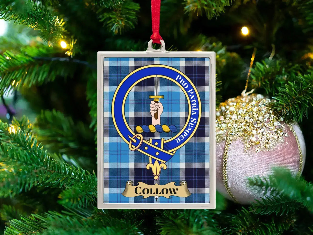 Collow clan crest Christmas ornament in a silver frame on a tartan background