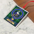 Comb ornament hanging from a Christmas tree branch by its satin ribbon