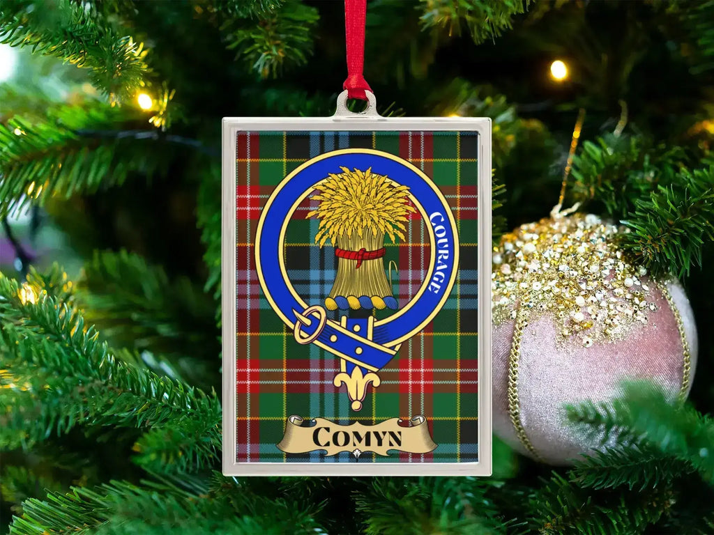 Comyn clan crest Christmas ornament in a silver frame on a tartan background