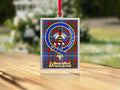 Close-up of the Congilton family crest on a polished silver-frame metal ornament