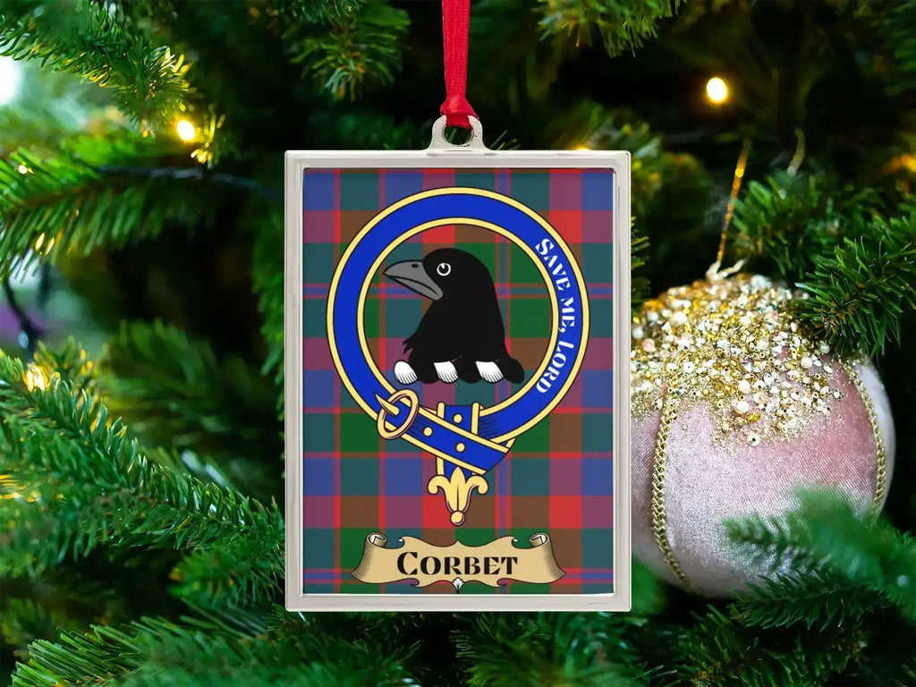 Corbet clan crest Christmas ornament in a silver frame on a tartan background