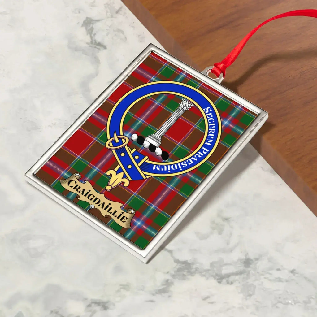 Craigdaillie ornament hanging from a Christmas tree branch by its satin ribbon