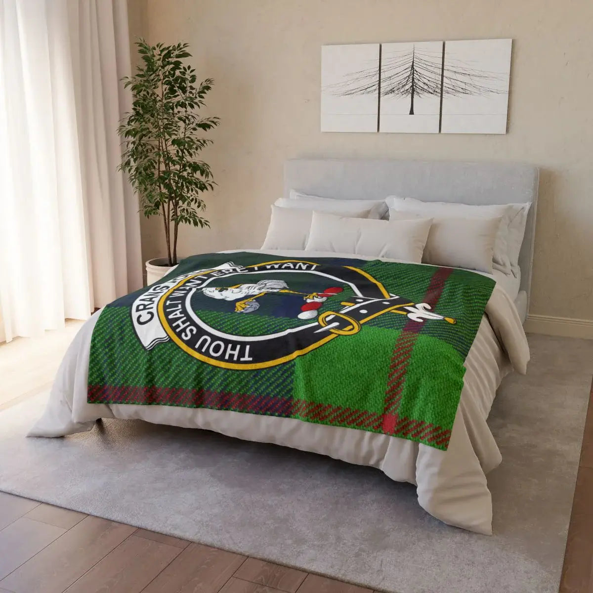 Cranstoun clan crest throw blanket draped over sofa — full-colour tartan print, white reverse