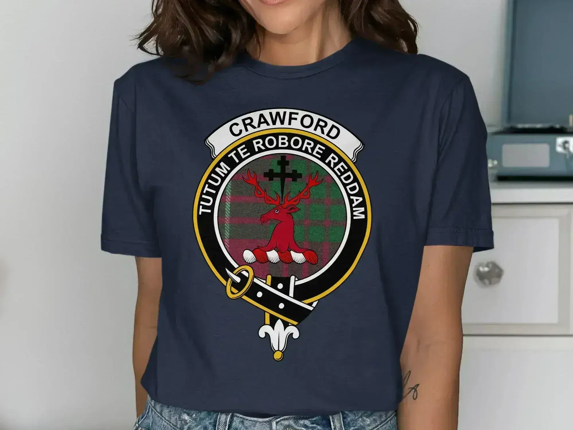 Crawford tartan pattern tee in navy — clan crest emblem over red-green plaid design