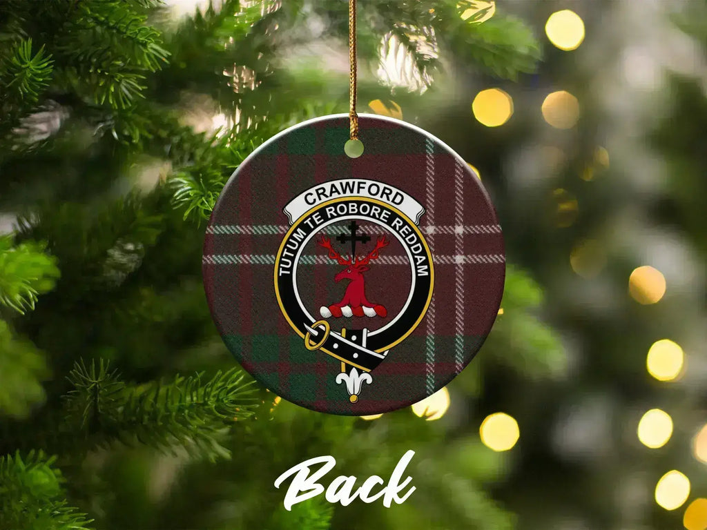 Crawford tartan crest ornament on Christmas tree — stag heraldic design with Strength motto visible