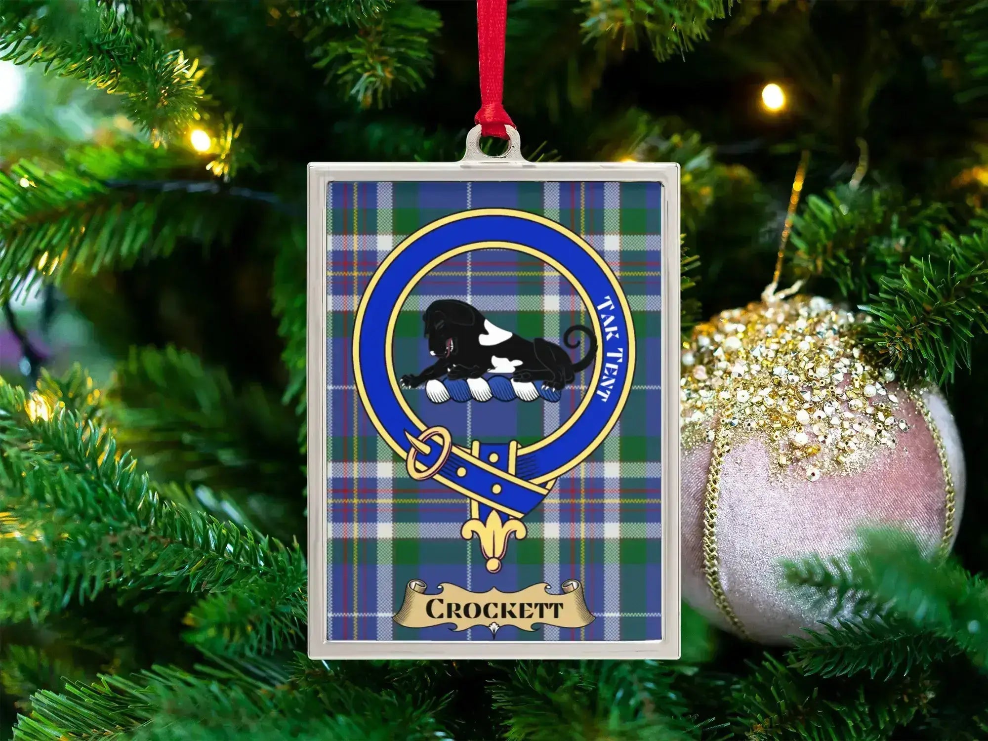 Crockett clan crest Christmas ornament in a silver frame on a tartan background