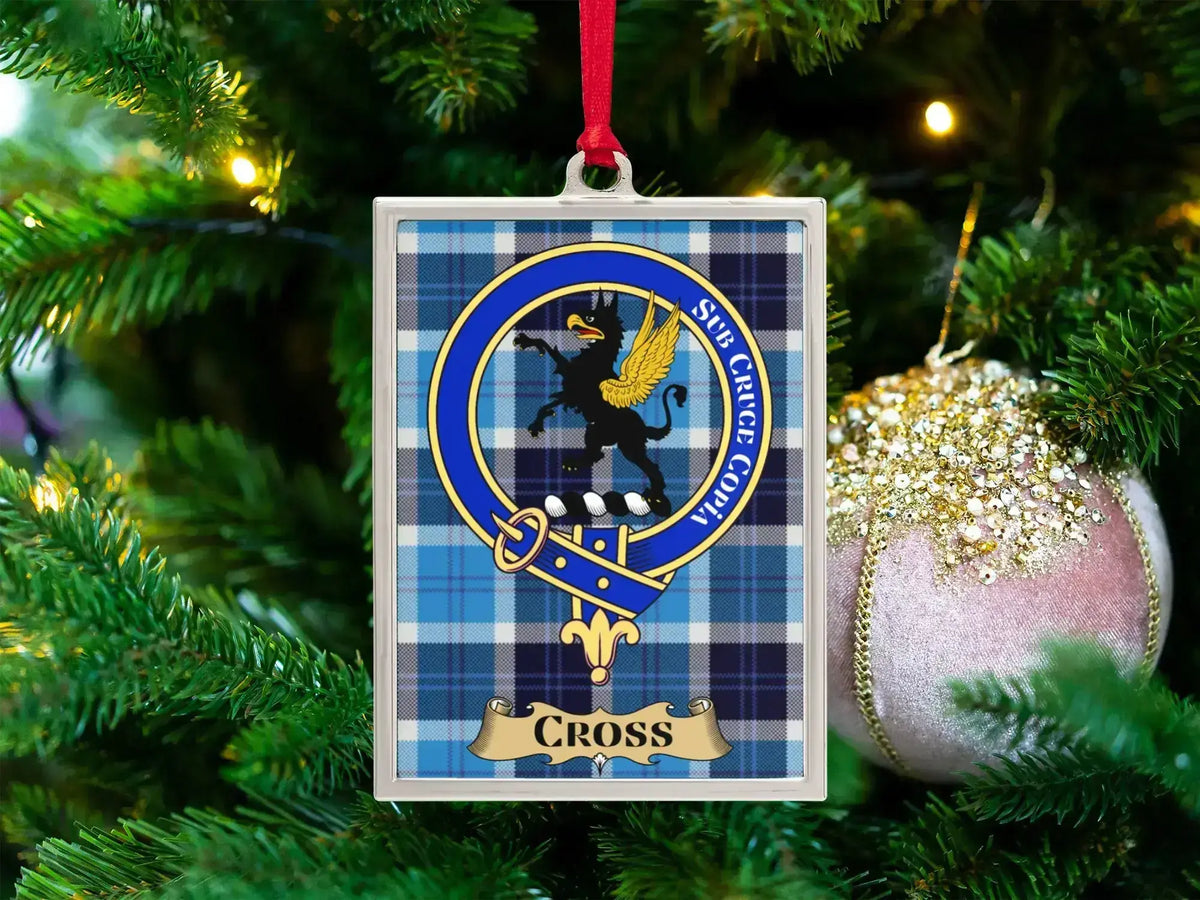 Cross clan crest Christmas ornament in a silver frame on a tartan background