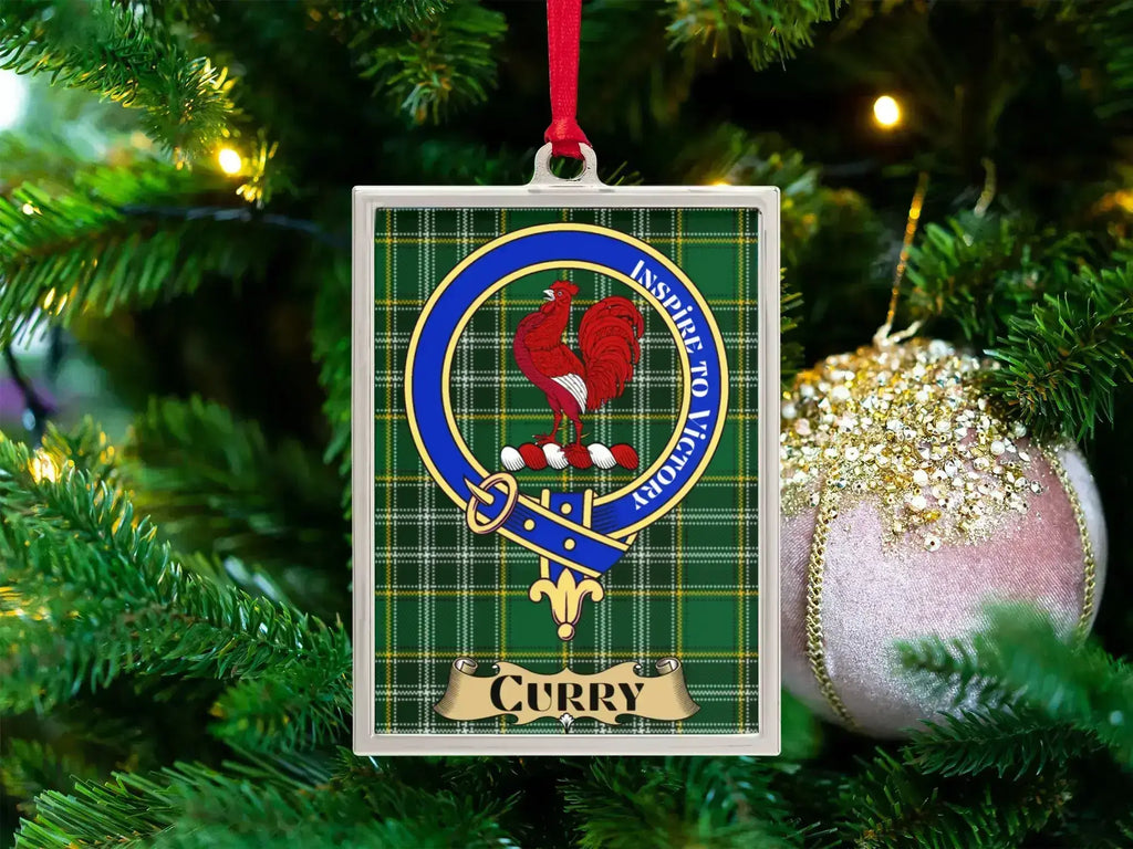 Curry clan crest Christmas ornament in a silver frame on a tartan background