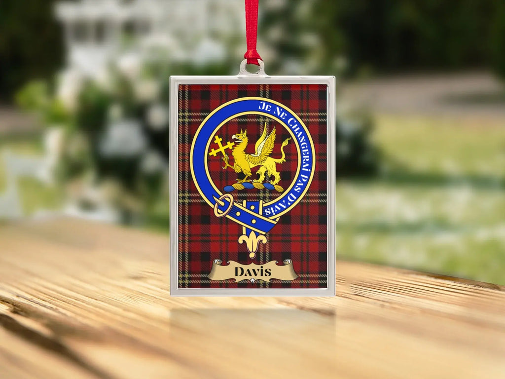 Close-up of the Davis family crest on a polished silver-frame metal ornament
