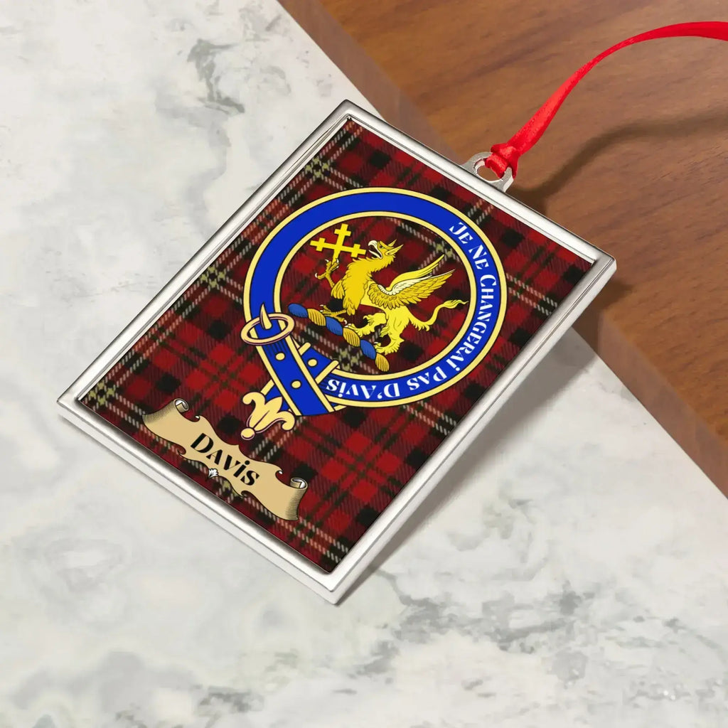 Davis ornament hanging from a Christmas tree branch by its satin ribbon