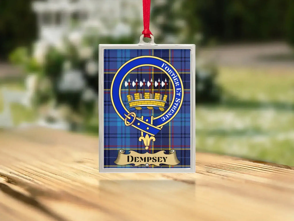 Close-up of the Dempsey family crest on a polished silver-frame metal ornament