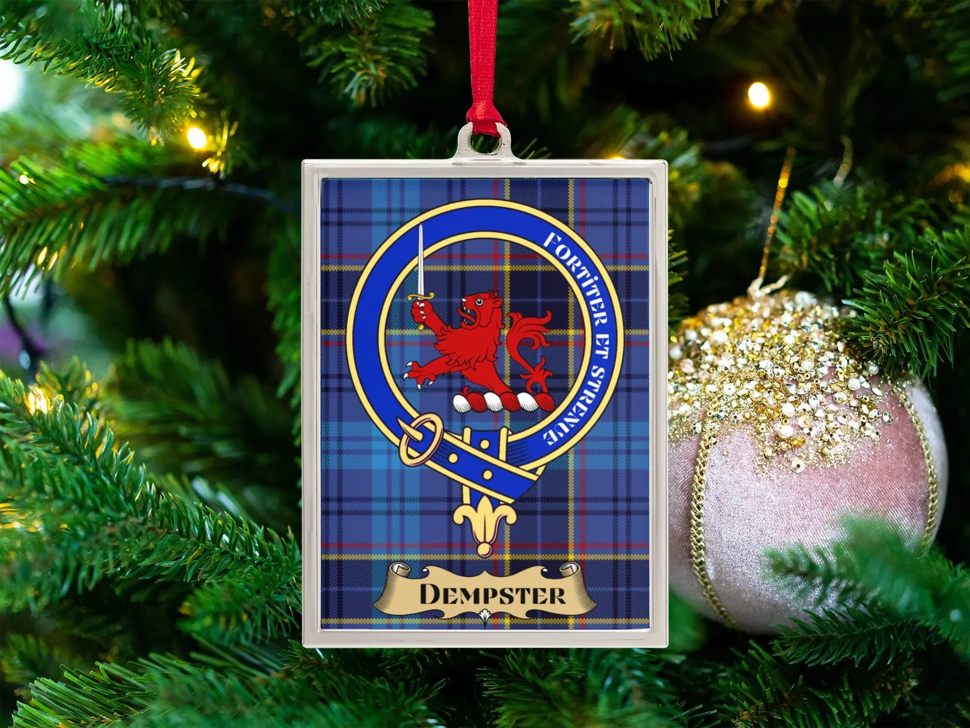 Dempster clan crest Christmas ornament in a silver frame on a tartan background