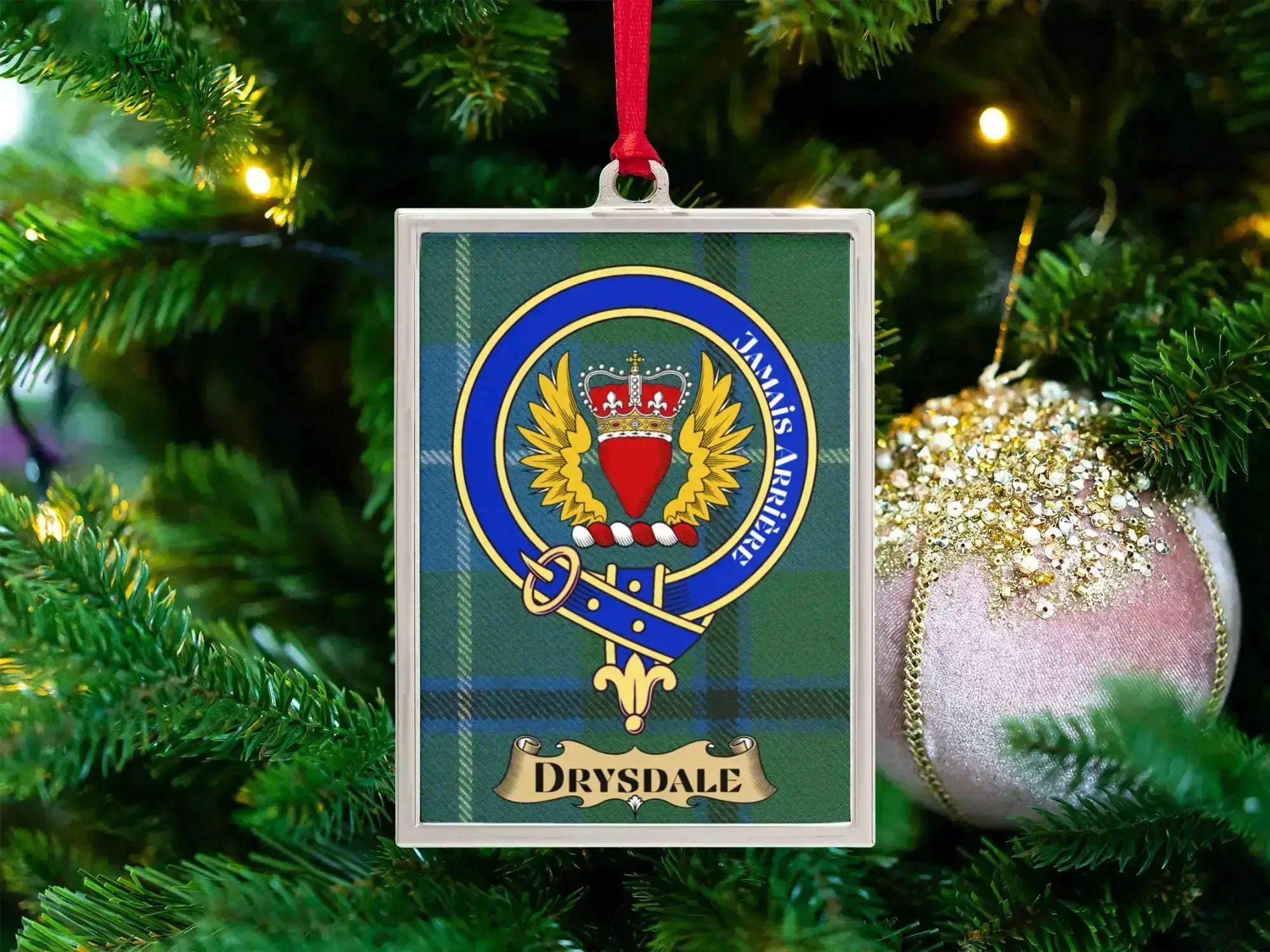 Drysdale clan crest Christmas ornament in a silver frame on a tartan background