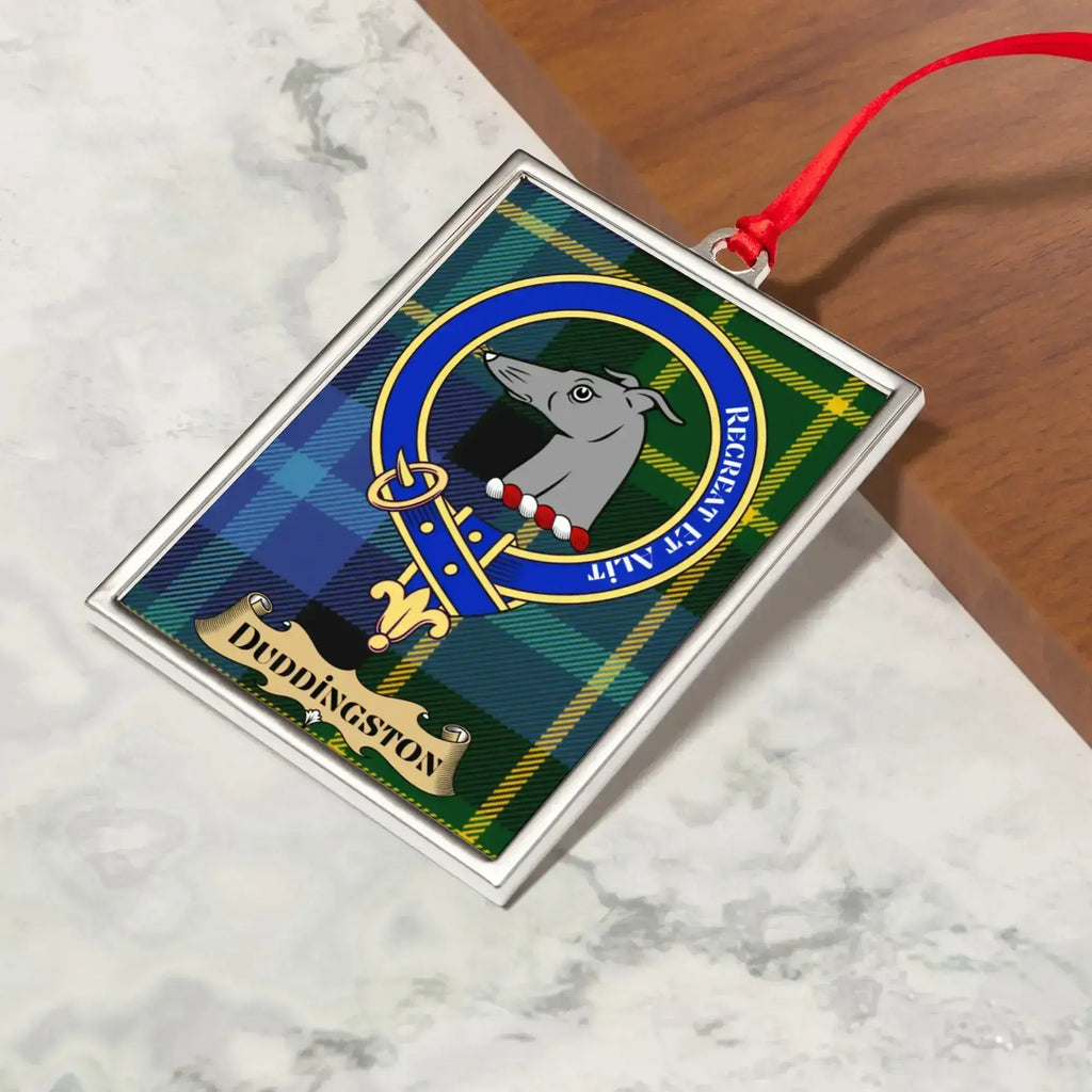 Duddingston ornament hanging from a Christmas tree branch by its satin ribbon